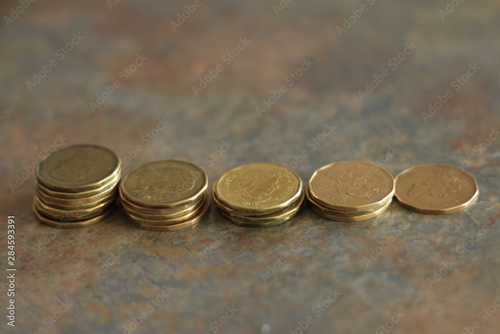 Canadian coins. Pile of Canadian dollar coins aka loonies Stock Photo