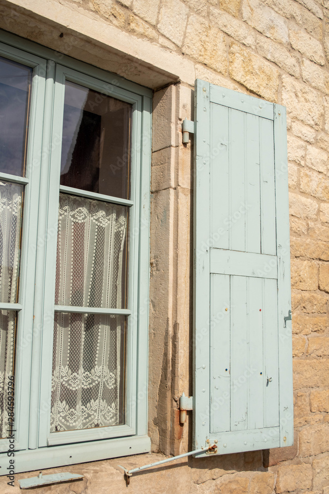 Fototapeta premium old window with wooden shutters