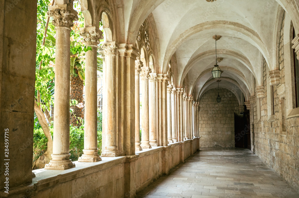 Courtyard with columns and arches in old Dominican monastery in Dubrovnik, Croatia