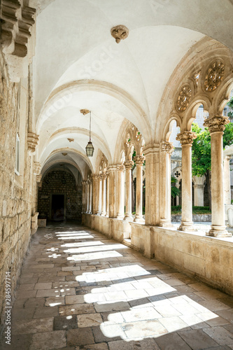 Courtyard with columns and arches in old Dominican monastery in Dubrovnik, Croatia