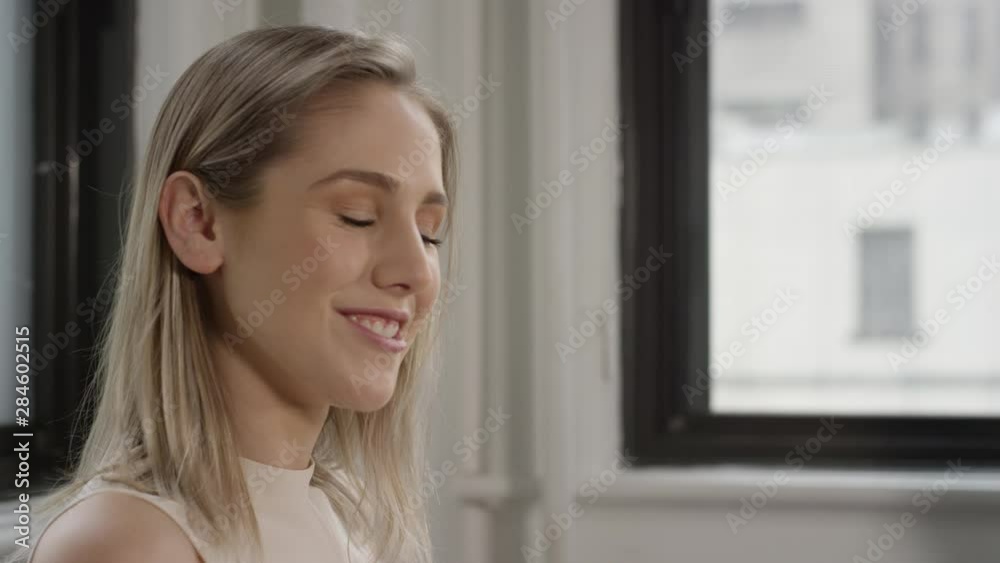 Beautiful young blonde woman looks confidently at the camera Beautiful young blonde woman looks confidently at the camera