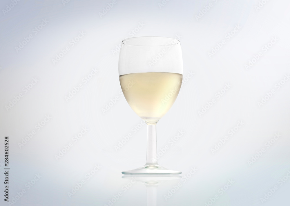 White wine in a glass isolated on white background. White wine in a glass isolated on white background.
