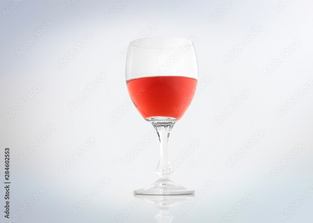Rosé wine in a glass isolated on white background . Rosé wine in a glass isolated on white background .