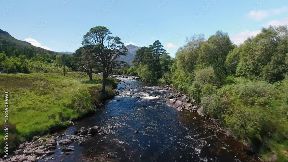 Aerial view on river with stones and trees, nice sunny day Aerial view on river with stones and trees, nice sunny day