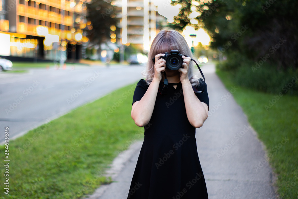 Cute Girl Photographer in Black Dress 
