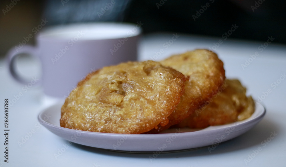 Bowsprit cake or kue cucur on white plate. Indonesian traditional cake. Bowsprit cake or kue cucur on white plate. Indonesian traditional cake.