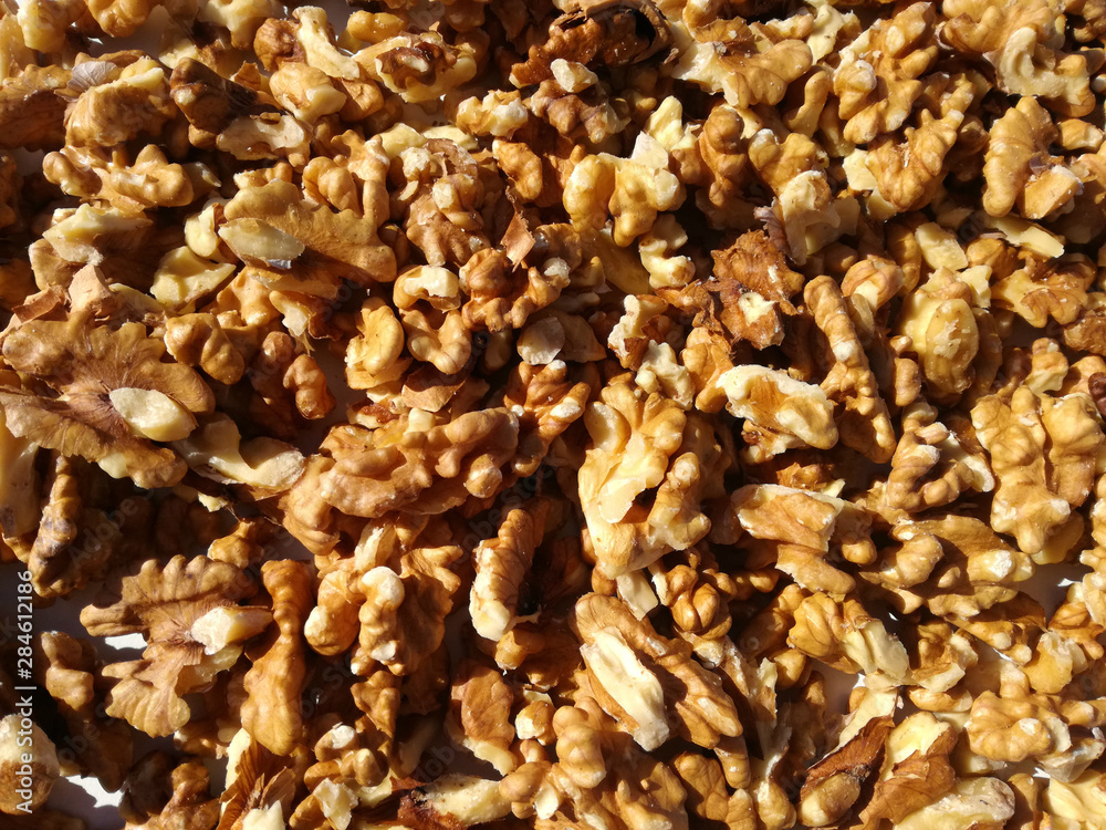 Group of nuts in the foreground. Dried fruits without skin. Natural peeled fruit. Walnut kernels skinless. Group of nuts in the foreground. Dried fruits without skin. Natural peeled fruit. Walnut kernels skinless.