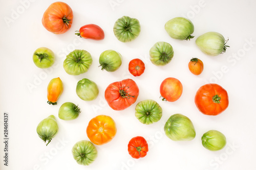Fototapeta Naklejka Na Ścianę i Meble -  Summer harvest of vegetables concept. Set of green and red tomatoes.