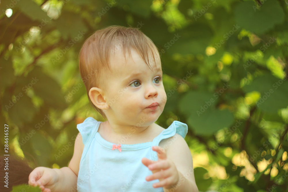 little short-haired child having fun outdoors in summer in the rays of sunny sunset little short-haired child having fun outdoors in summer in the rays of sunny sunset