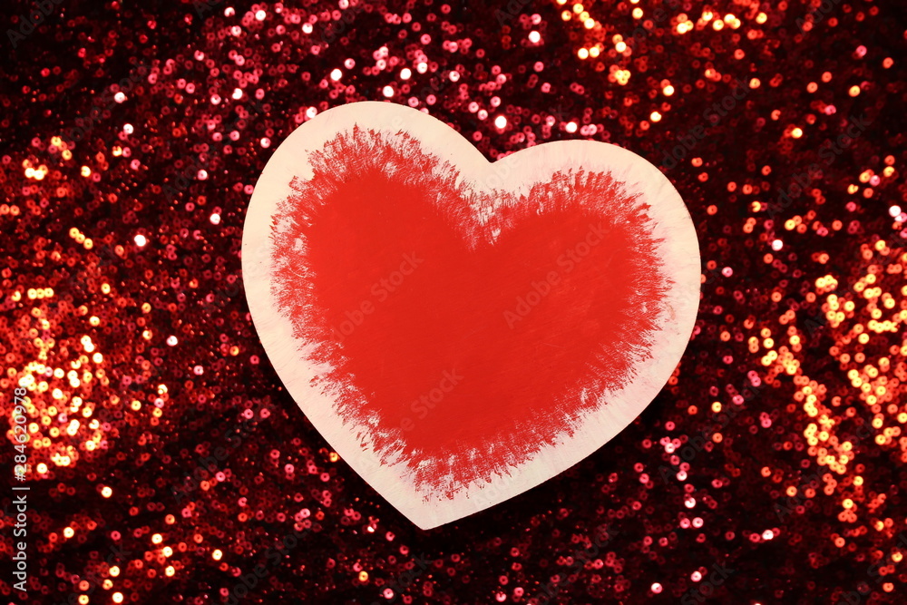 beautiful red heart on red shiny background beautiful red heart on red shiny background