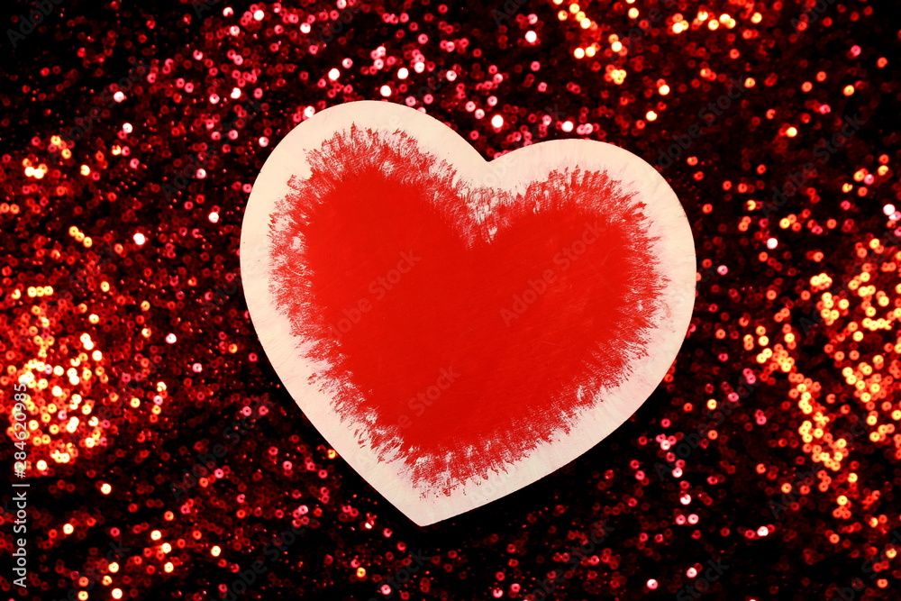 Fototapeta premium beautiful red heart on red shiny background