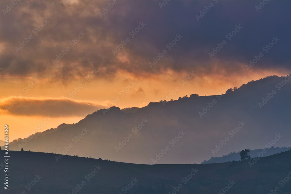 Magestic sunset in the carpatian mountains. Natural autumn landscape.