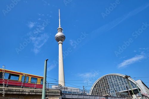 The Television Tower in Berlin with a commuter train entering the trainstation