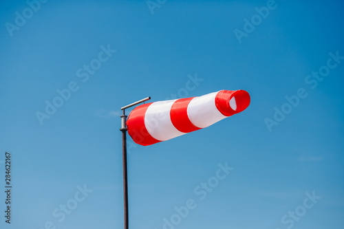 Windsock indicator of wind on runway airport vane anemometer