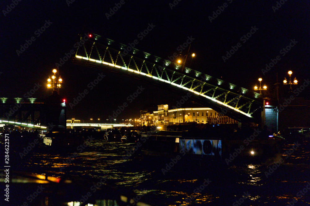 single Opening bridge in St. Petersburg at night in Russia.