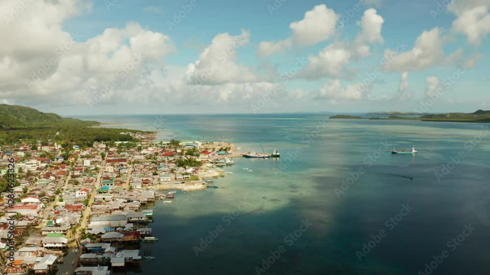 Passenger port with ferries and cargo ships on the island of Siargao,aerial view. Dapa Ferry Terminal. Siargao, Philippines. Passenger port with ferries and cargo ships on the island of Siargao,aerial view. Dapa Ferry Terminal. Siargao, Philippines.