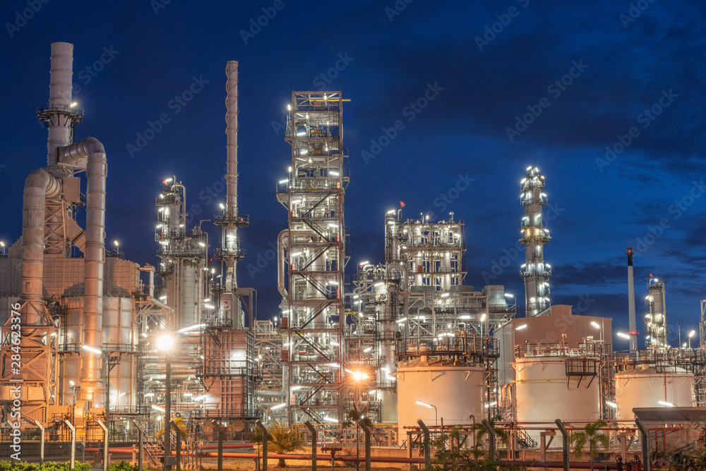 .Landscape of Oil and Gas Refinery Manufacturing Plant., Petrochemical or Chemical Distillation Process Buildings., Factory of Power and Energy Industrial at Twilight Sunset., Engineering Petroleum.