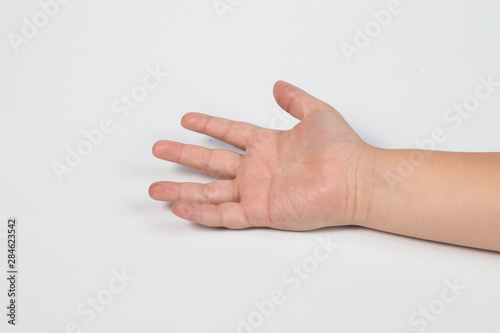 Selective focus hand of little Asian boy and fingers symbols in one two victory thum up and begging on white isolated background