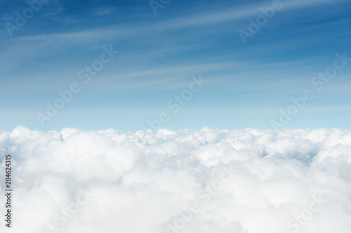 Fototapeta Naklejka Na Ścianę i Meble -  above the cumuls clouds, blue sky background