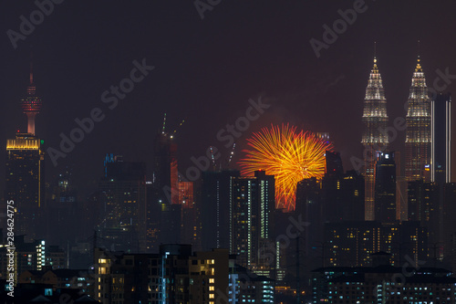 Photography Fireworks explode over the Petronas Twin Towers during the midnight display on 45th anniversary of Petronas at downtown Kuala Lumpur