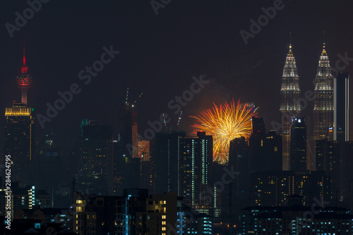 Photography Fireworks explode over the Petronas Twin Towers during the midnight display on 45th anniversary of Petronas at downtown Kuala Lumpur