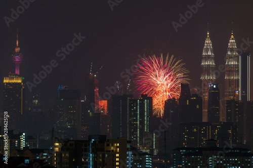 Fireworks explode over the Petronas Twin Towers during the midnight display on 45th anniversary of Petronas at downtown Kuala Lumpur.
