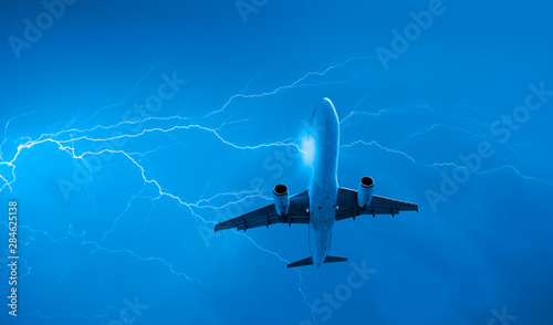 Airplane in the sky with thunder and lightning