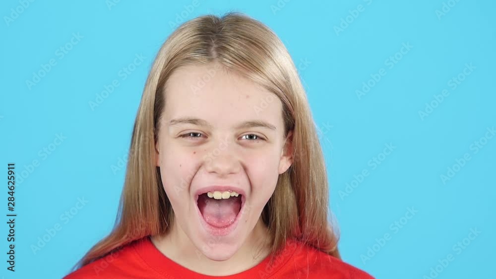 Close-up child very screams looking at the camera. Slow motion Close-up child very screams looking at the camera. Slow motion