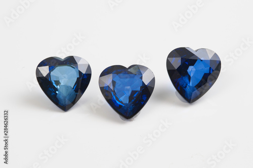 Precious sapphire carved in the shape of a heart .