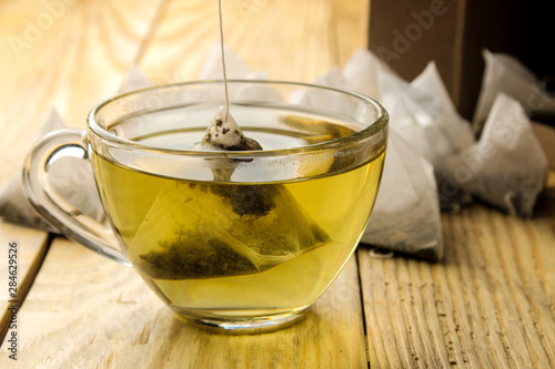 Fotografie cup with tea and tea bag pyramid