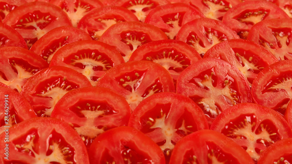 Sliced tomato background. Top view. Sliced tomato background. Top view.