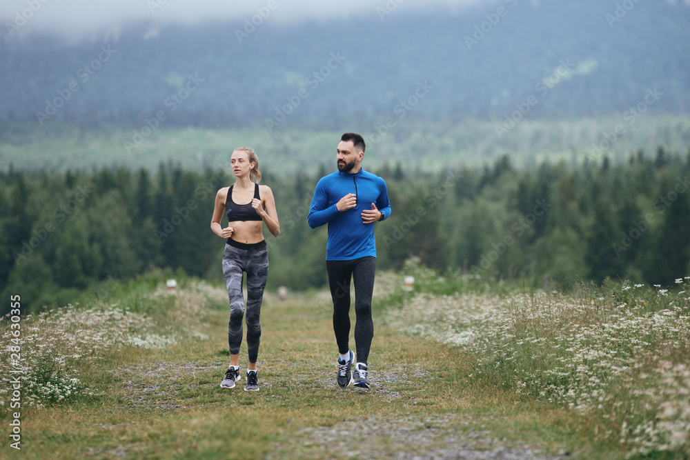 Man and woman jogging together outdoor Man and woman jogging together outdoor