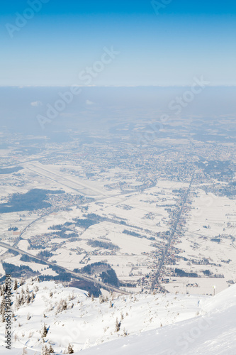 Untersberg Summit. The view from the summit of Untersberg mountain in Austria. The mountain straddles the border between Germany and Austria and in the background can be seen the city of Salzburg.