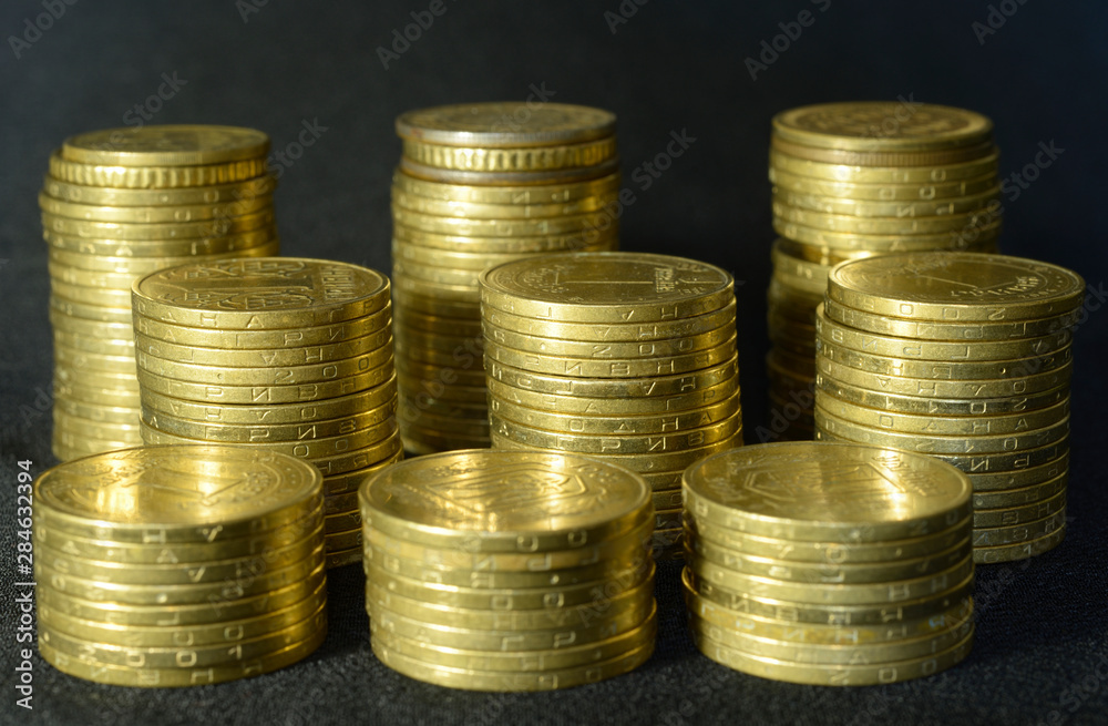 Piles of one hryvnia coins, currency of Ukraine Piles of one hryvnia coins, currency of Ukraine