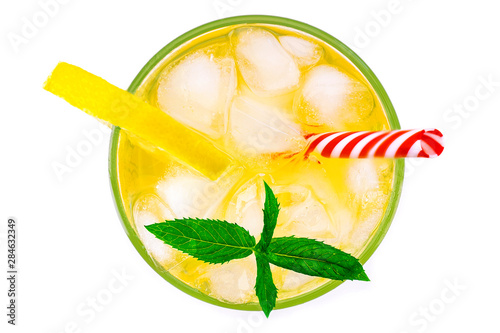 Glass of fresh cocktail lemonade, honey lemon soda drink with leaves of mint isolated on white background. Top view.
