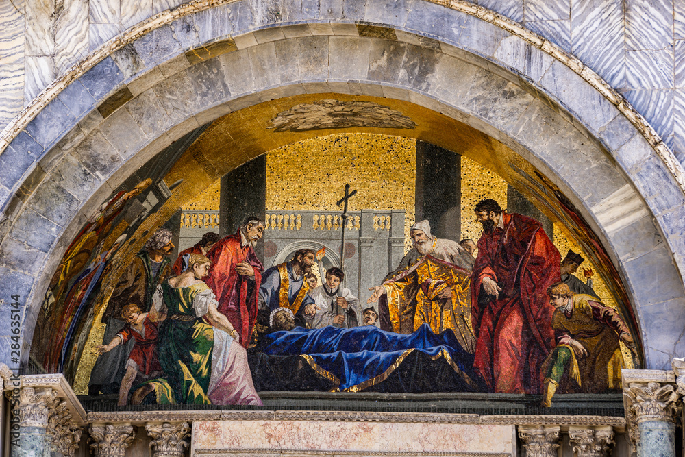 Saint Mark's body venerated by the doge mosaic at facade of Basilica di San Marco in Venice, Italy