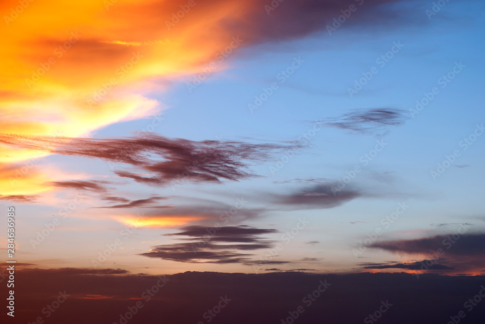 Dramatic beautiful sunset. Orange and yellow colors sky light. - Image