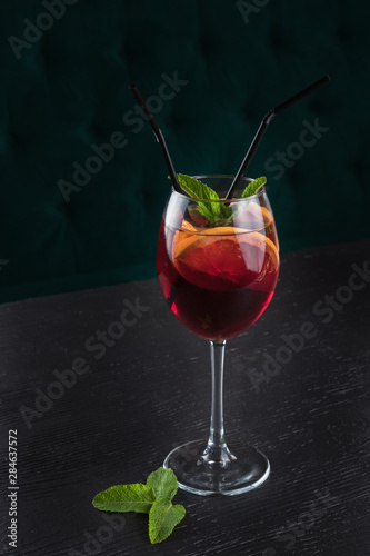 Fotografie, Obraz Cold sangria in a wine glass with mint