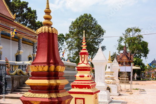 Stupa, traditional Buddhist burial gravestones at a temple in a rural area of Cambodia photo