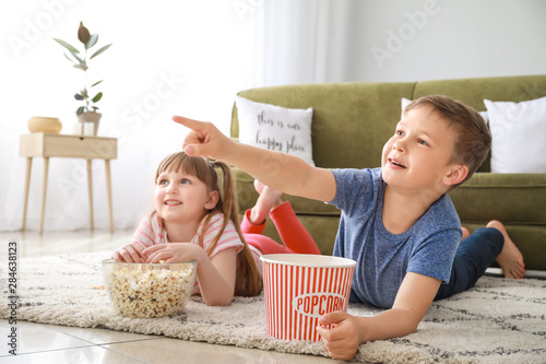 Little children watching TV...
