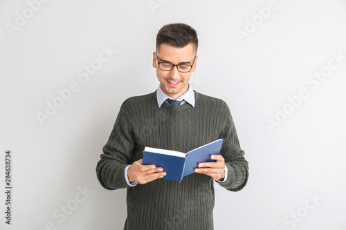 Handsome male teacher with ...