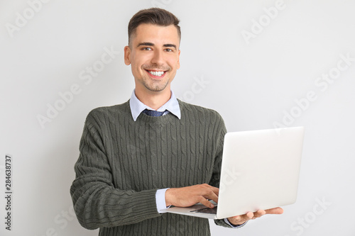 Handsome male teacher with ...