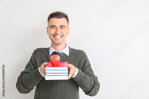 Handsome male teacher with ...