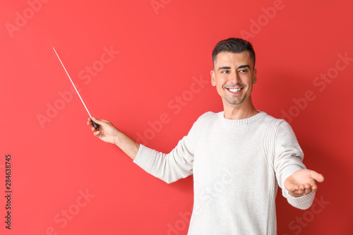 Handsome male teacher with ...
