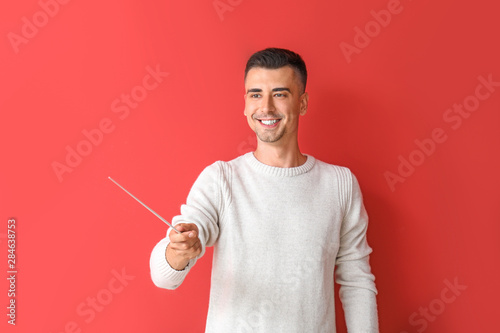 Handsome male teacher with ...