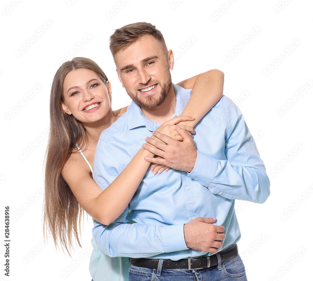 Happy young couple in love on white background Happy young couple in love on white background