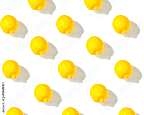 the lemon pattern on a white background with a shadow on the right © Mariya