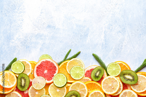 Different fresh fruits on color background
