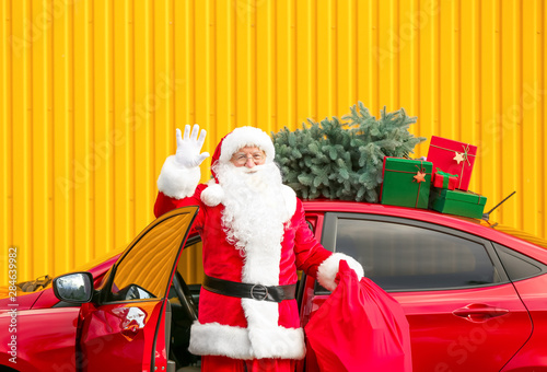 Santa Claus with gifts in b...