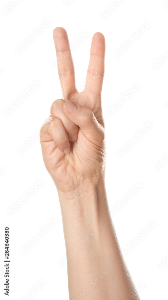 Female hand showing two fingers on white background Female hand showing two fingers on white background